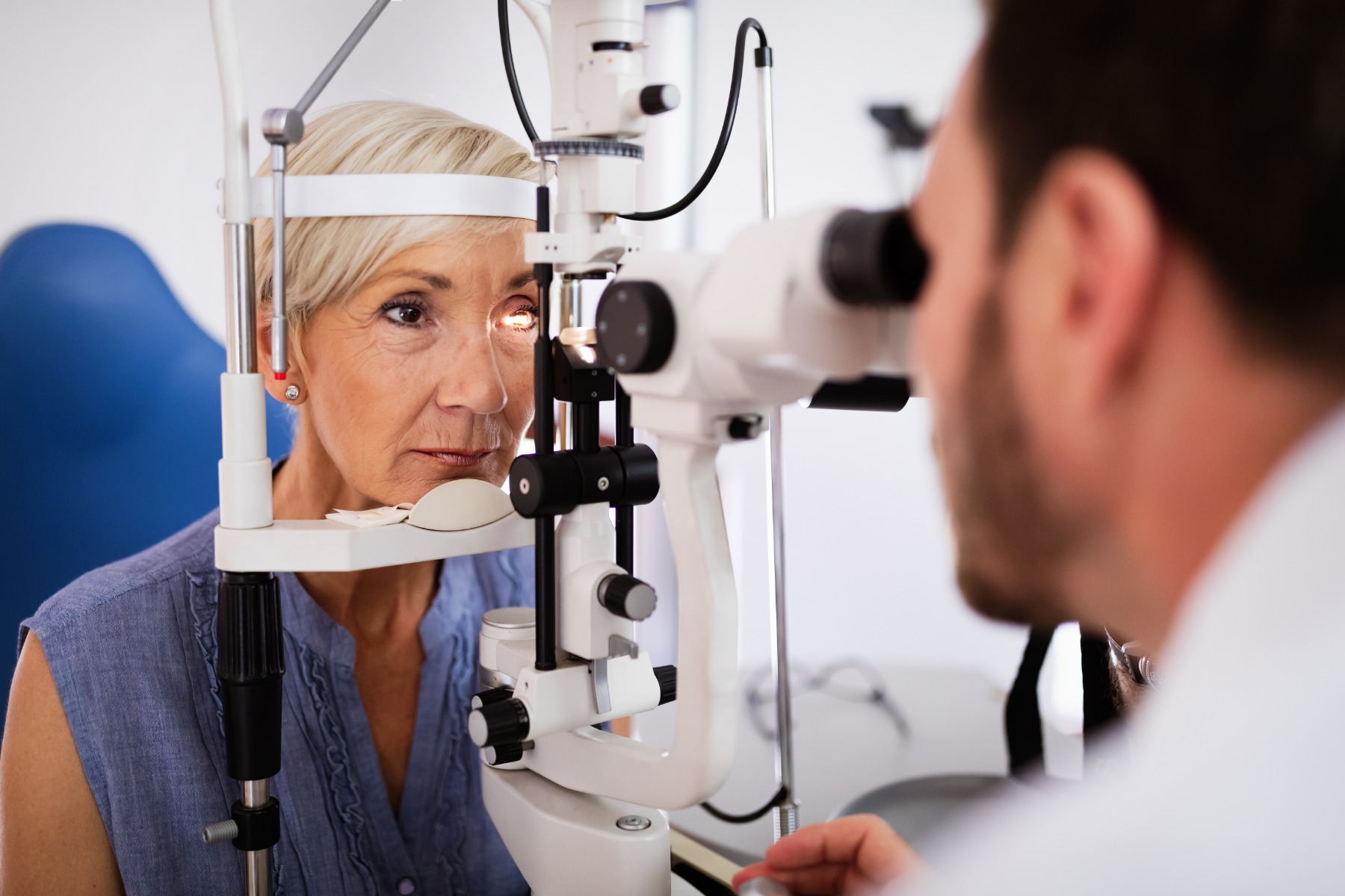 Woman having here eyes tested